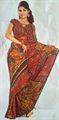 Brown color georjet printed saree with pipin application.(n38)