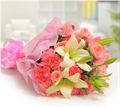 10 Pink Carnations, 8 Pink Roses and 2 White Lilies with Pink Paper Packing by FNP