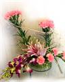 2 Lillies, 5 Orchids and 15 Carnations in a Basket by FNP Flowers