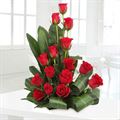 15 red roses in a basket by FNP Flowers